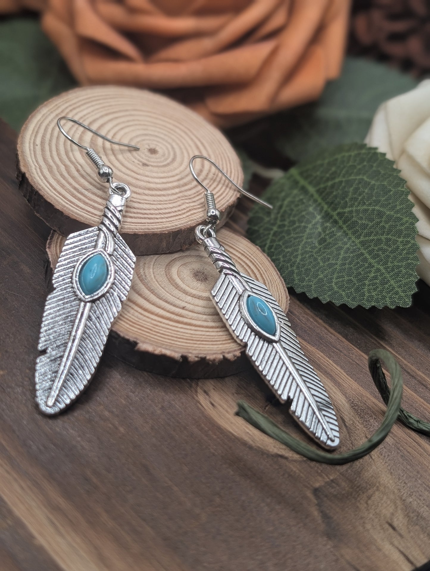 Feather drop earrings