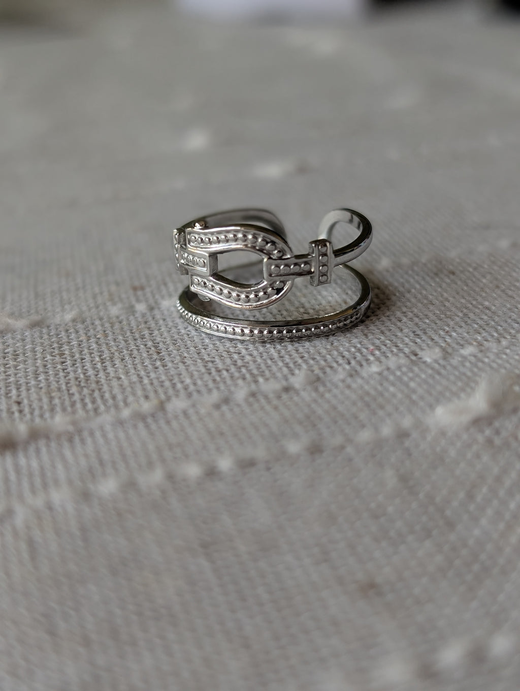 Double buckle open ring