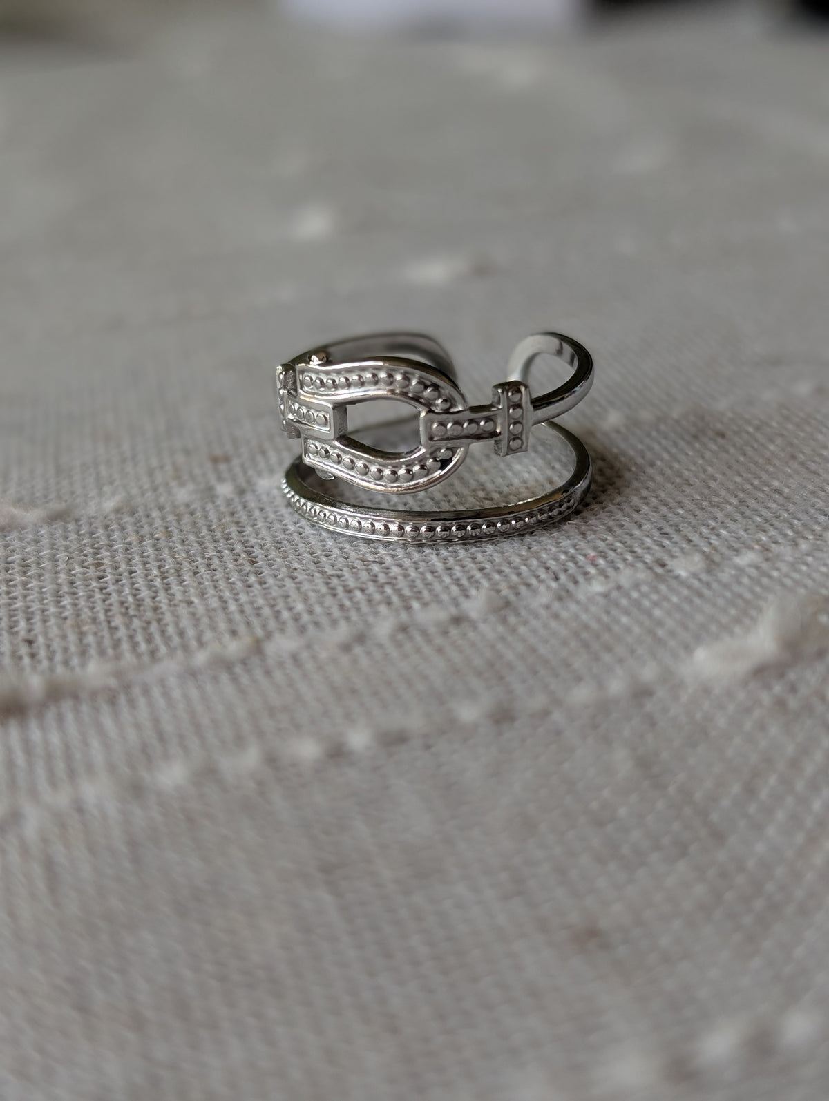 Double buckle open ring