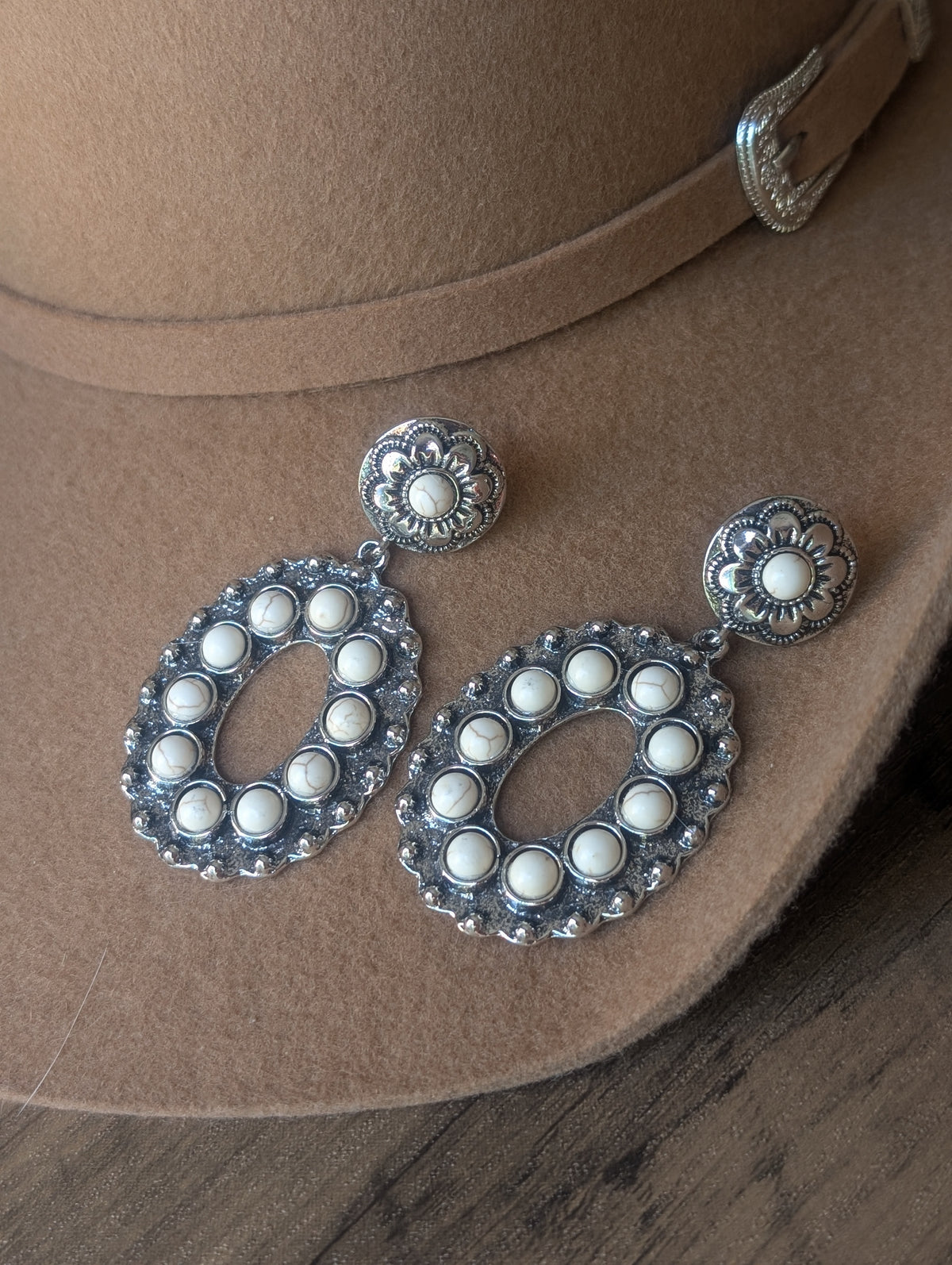 White oval drop earrings
