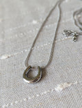Bullseye horseshoe necklace